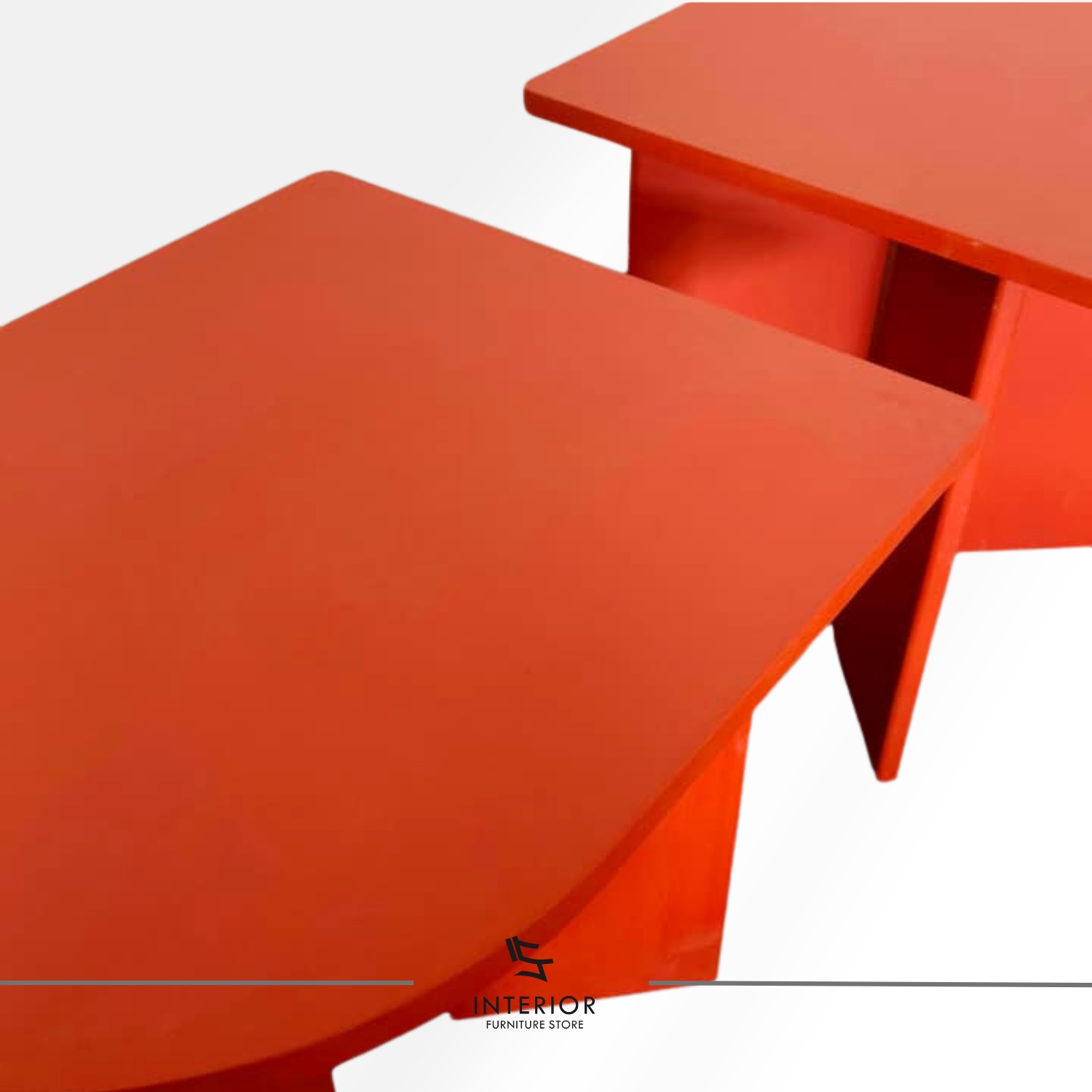 Modern dining table with bold geometric form and red finish, minimalist contemporary design