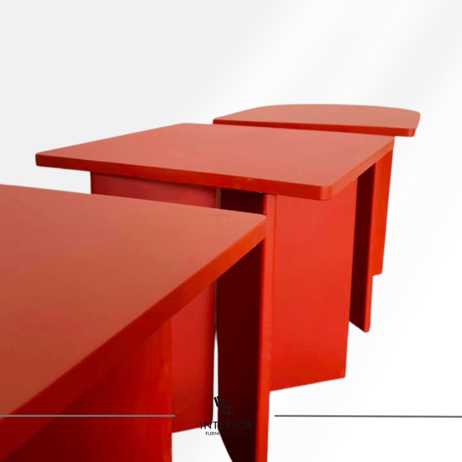 Modern dining table with bold geometric form and red finish, minimalist contemporary design