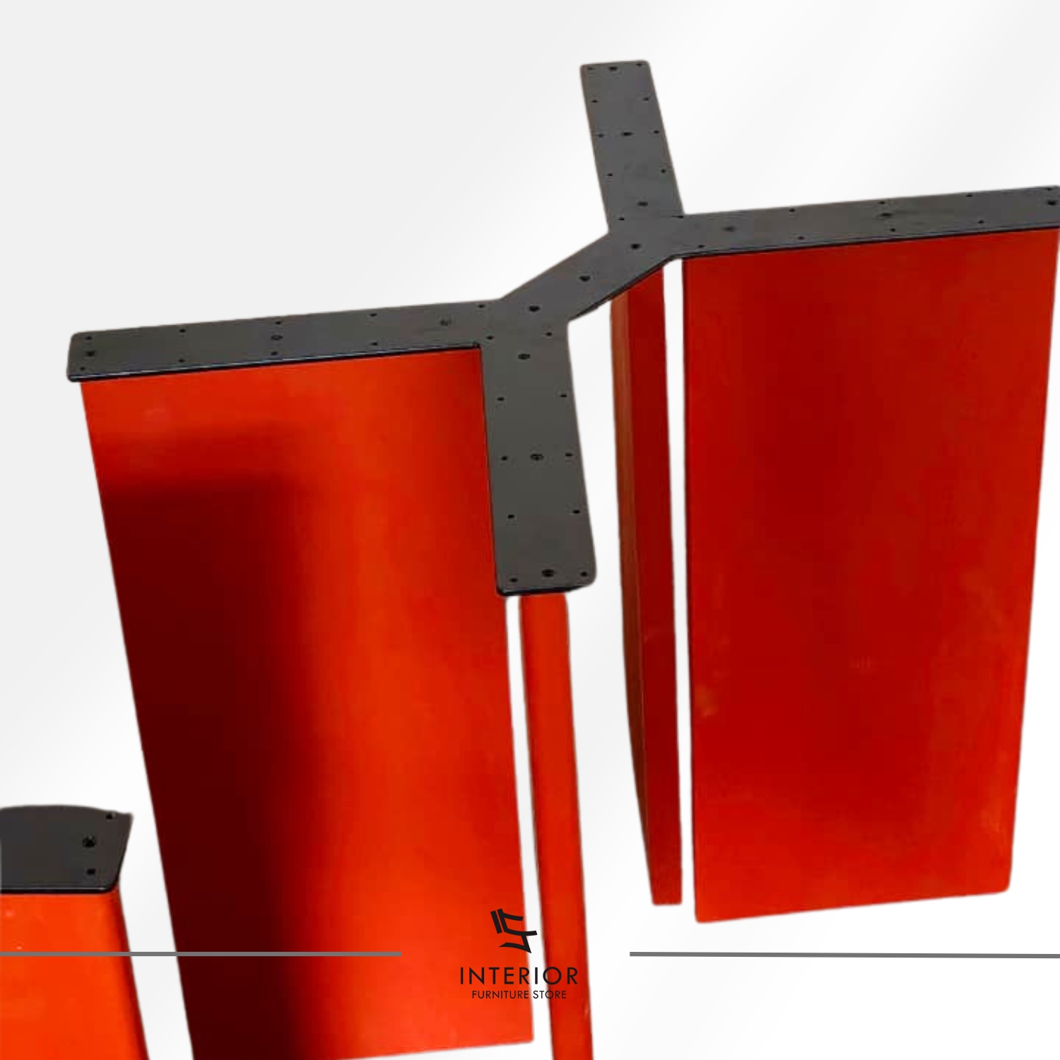 Modern dining table with bold geometric form and red finish, minimalist contemporary design