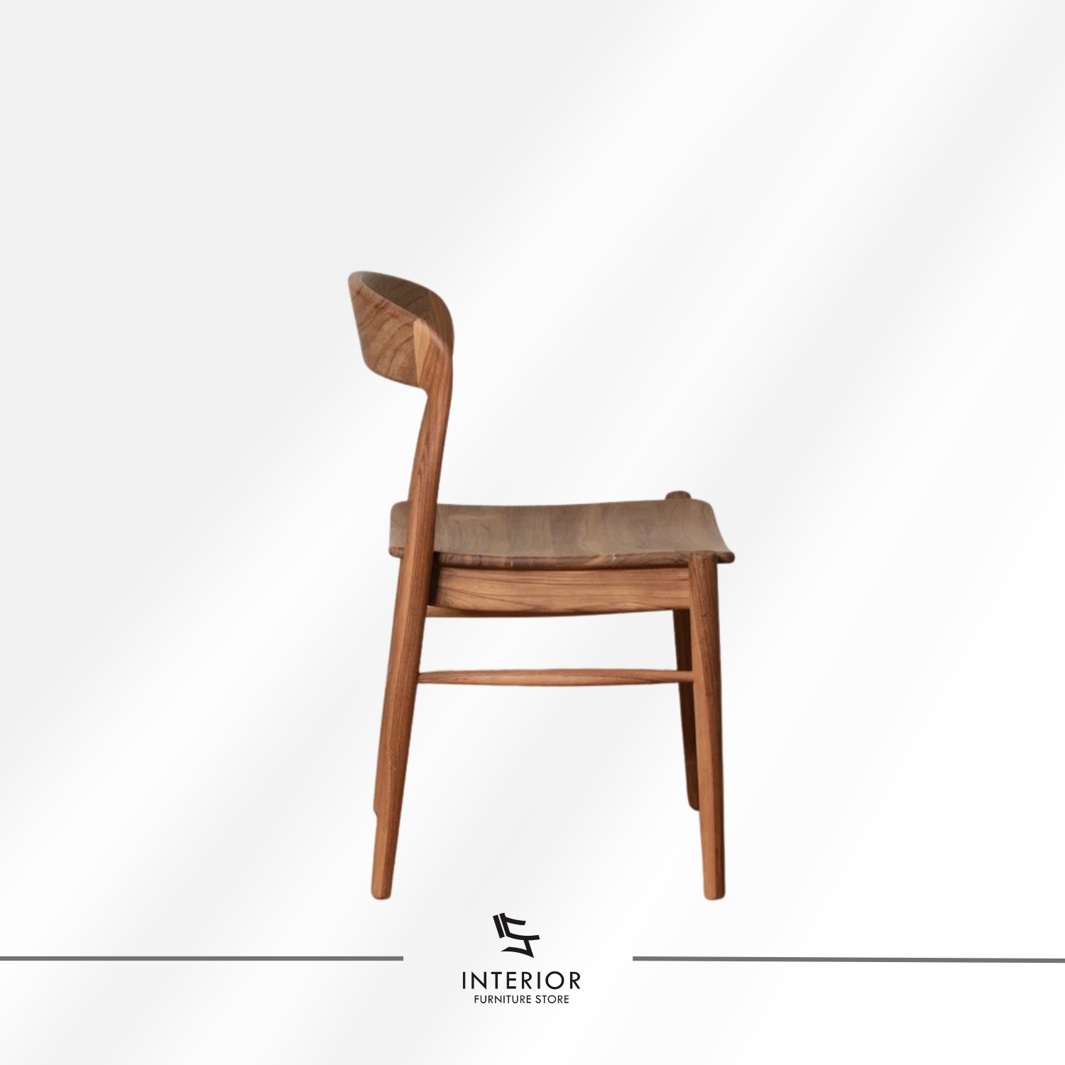 Solid wood dining chair with a contoured seat, curved backrest, and warm natural wood finish.