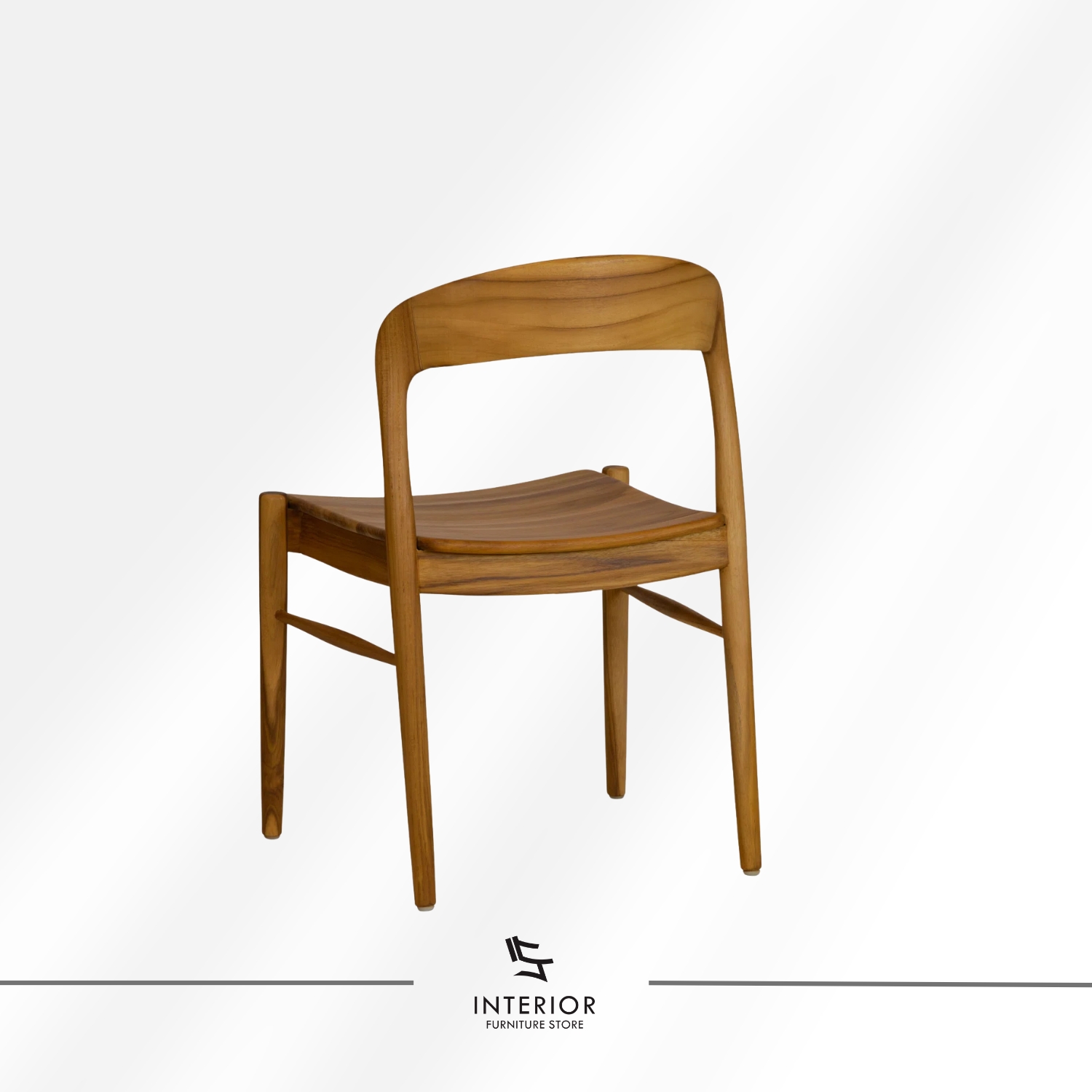Solid wood dining chair with a contoured seat, curved backrest, and warm natural wood finish.