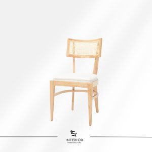 Wooden dining chair with a woven rattan backrest and cushioned seat.