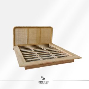 Wooden bed frame with a woven rattan headboard and slatted base in a natural finish.