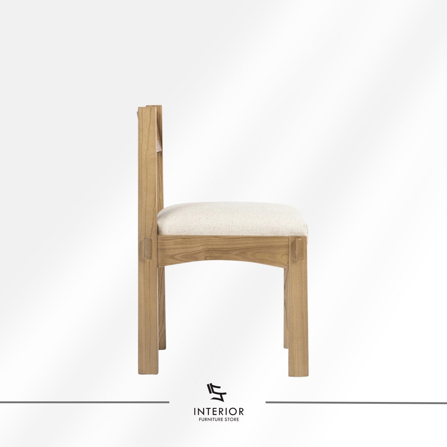 Solid wood dining chair with a cushioned upholstered seat and clean-lined silhouette.