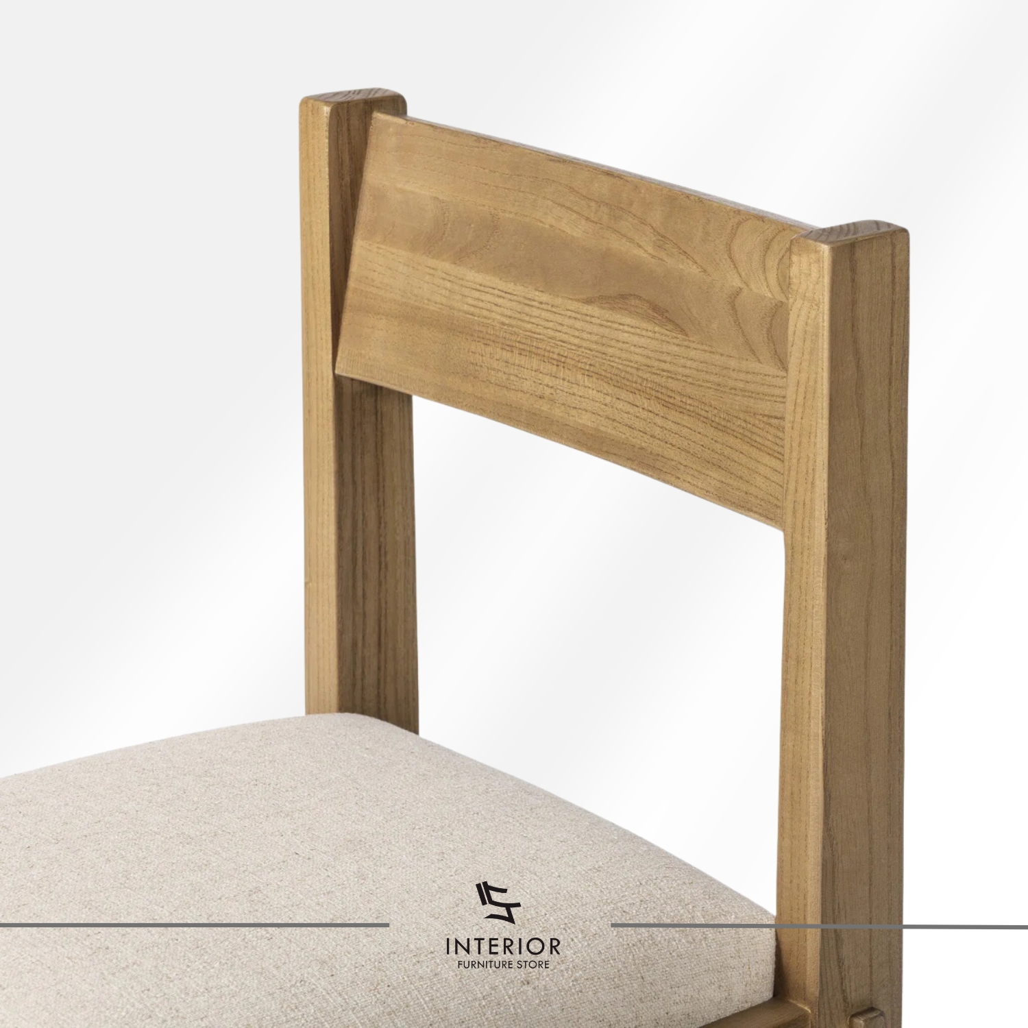 Solid wood dining chair with a cushioned upholstered seat and clean-lined silhouette.