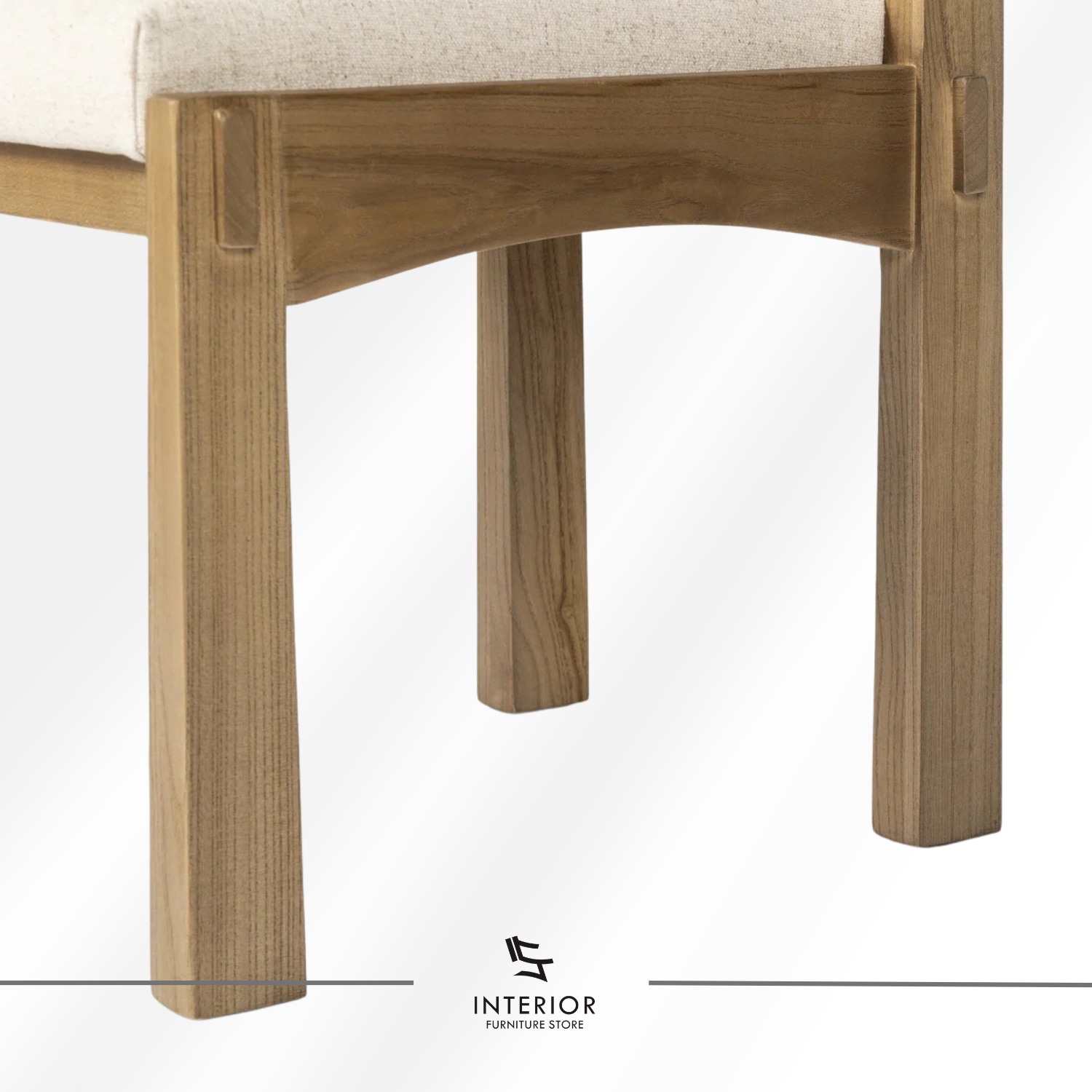 Solid wood dining chair with a cushioned upholstered seat and clean-lined silhouette.