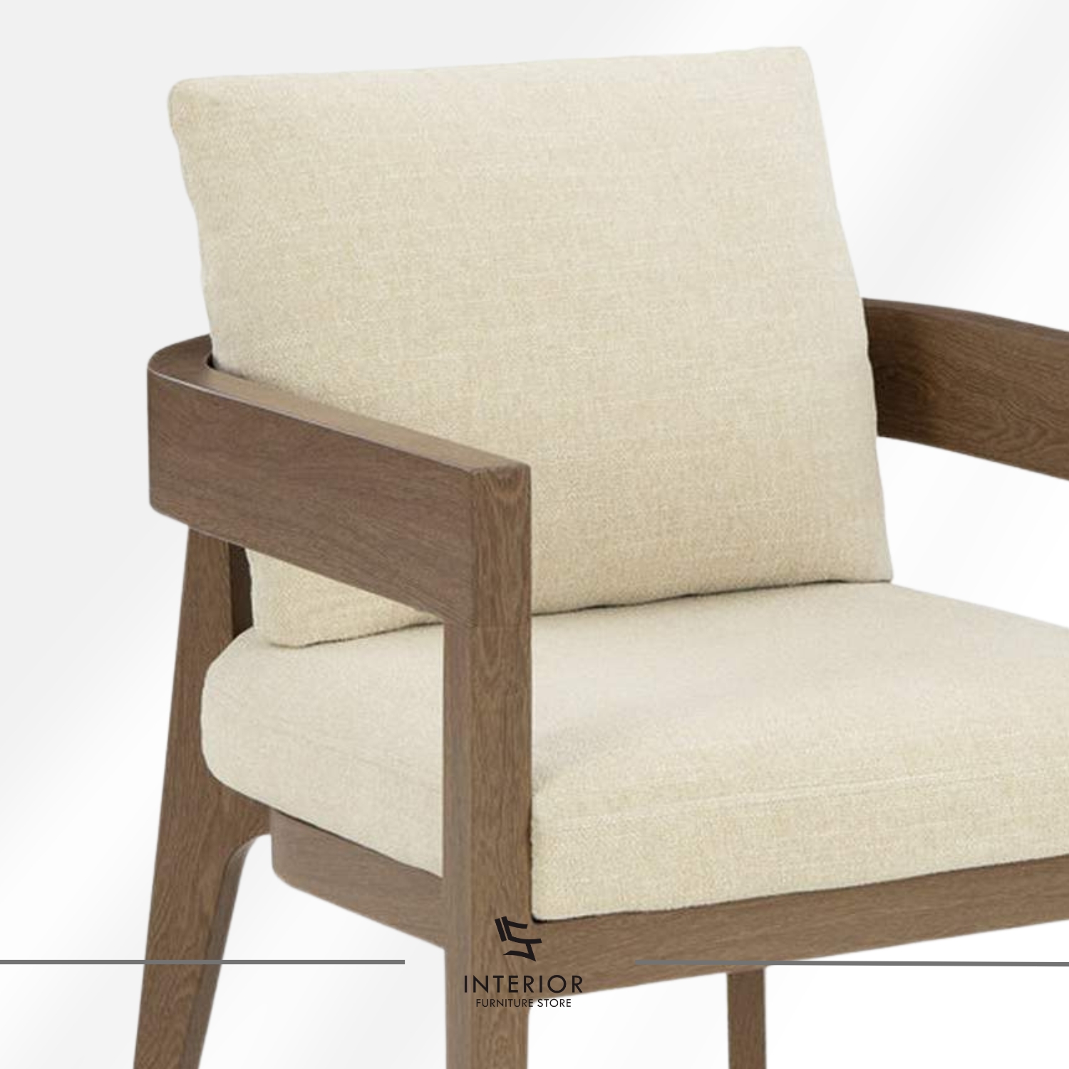 Solid wood armchair with wide armrests and soft cream upholstered seat, minimalist modern style