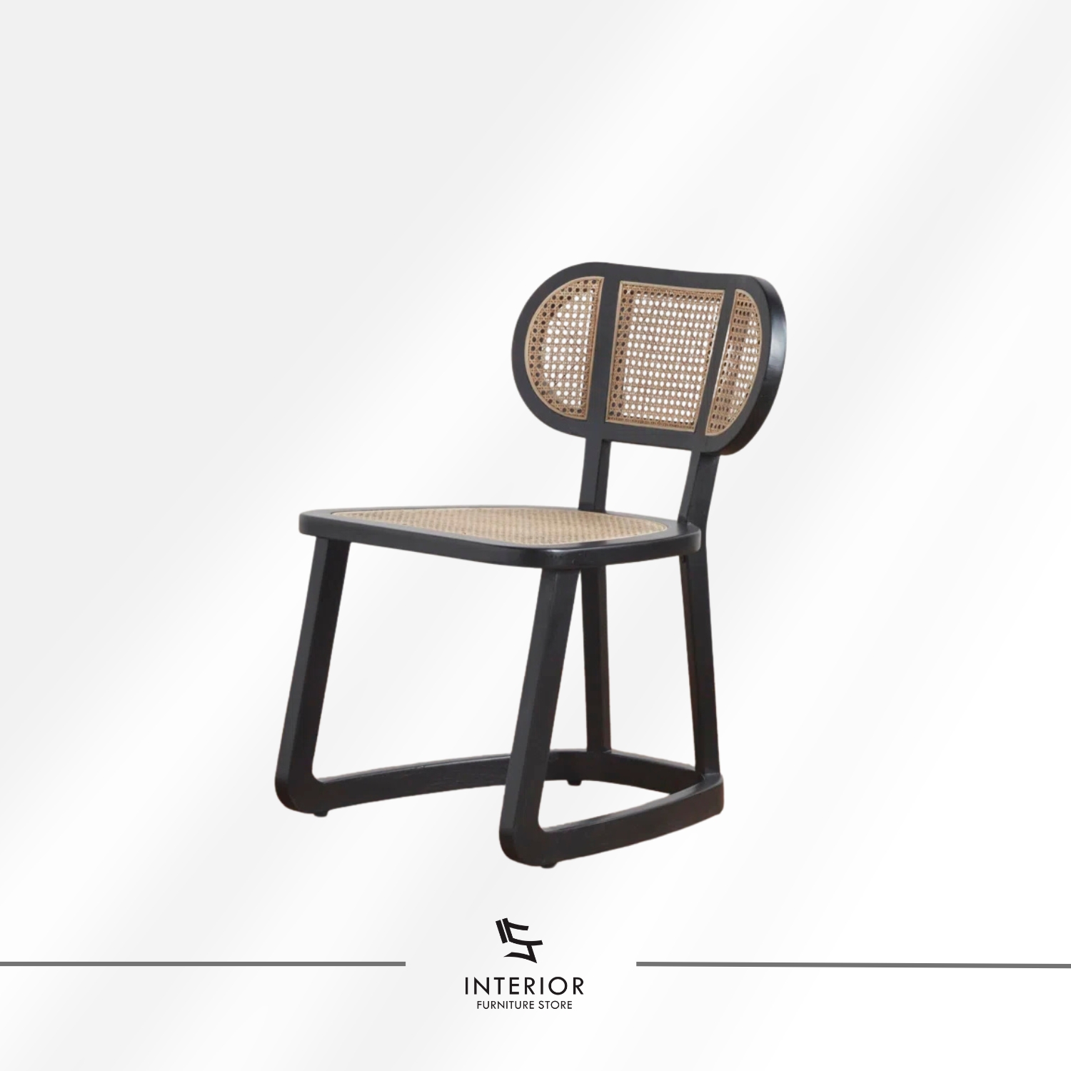 Black wooden dining chair with woven cane seat and backrest.