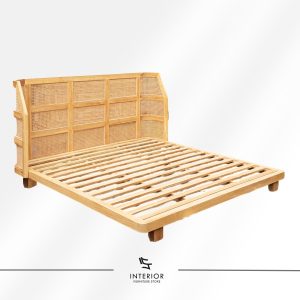 Wooden bed frame with a curved rattan headboard featuring woven panel details and a slatted base in a natural finish.
