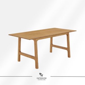 Minimalist solid wood dining table with a slim rectangular top and architectural trestle-style legs.