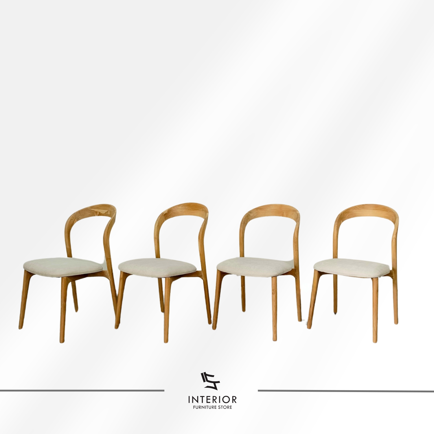 Modern wooden dining chair with a curved backrest, upholstered seat, and tapered legs.