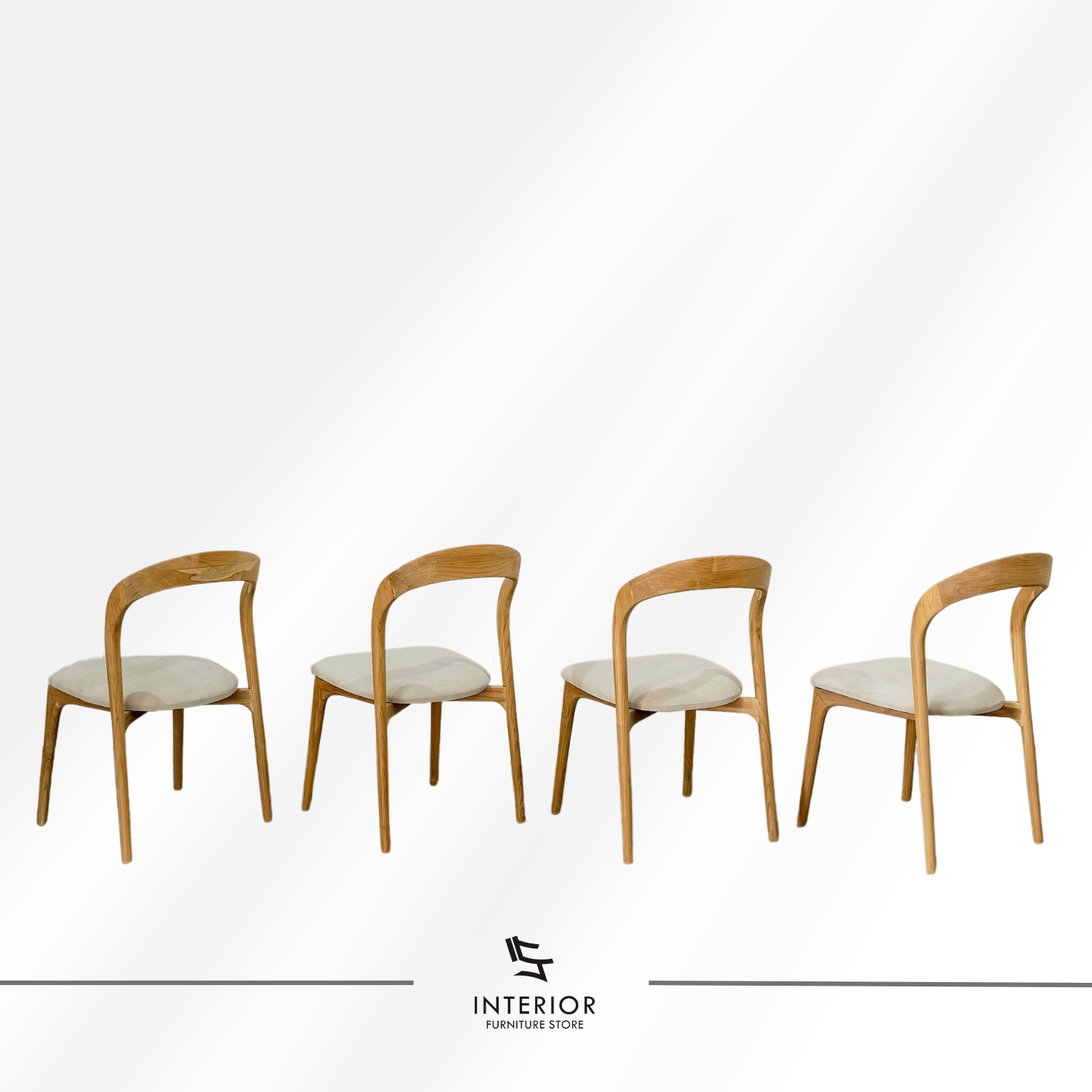 Modern wooden dining chair with a curved backrest, upholstered seat, and tapered legs.