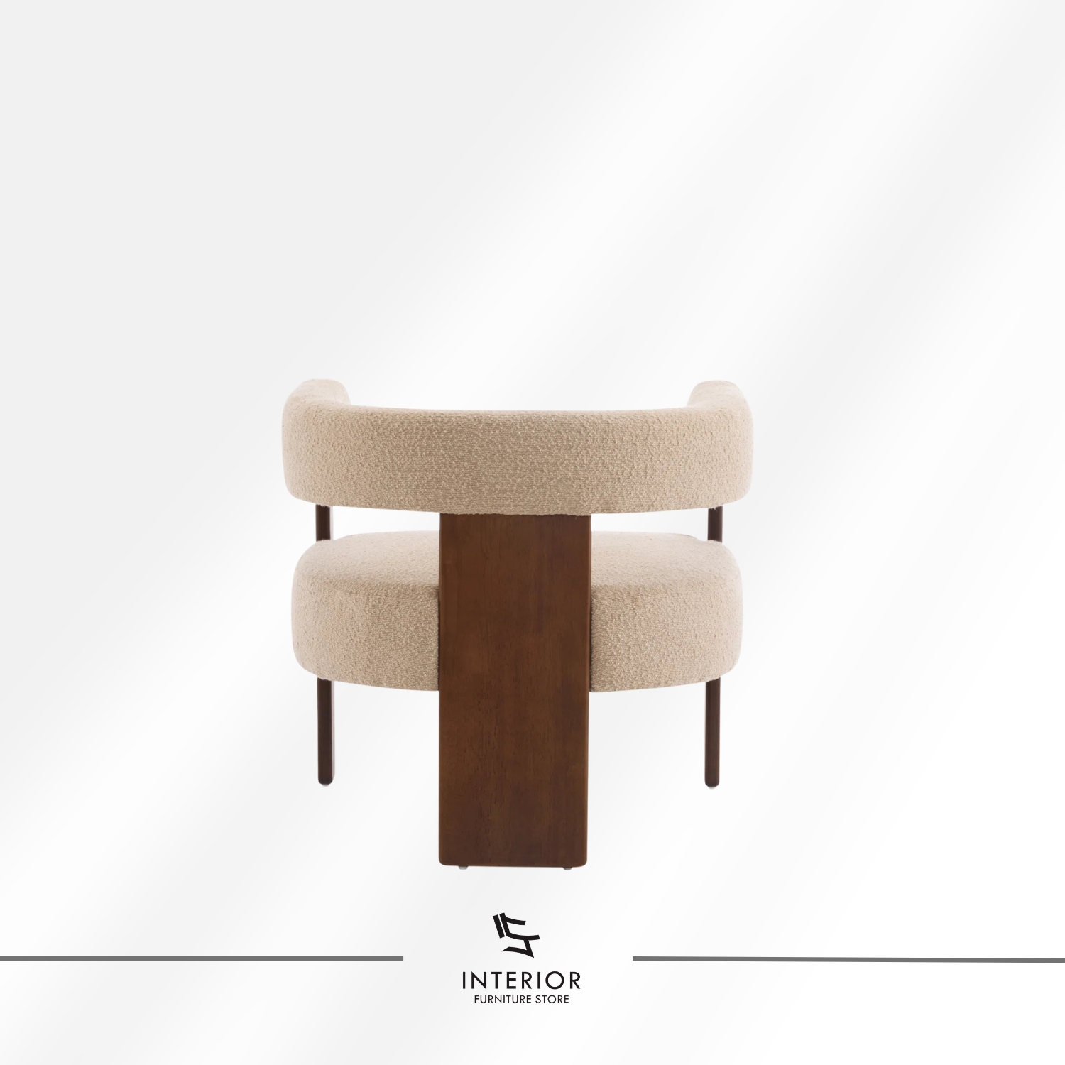 A modern armchair with a curved upholstered backrest and seat in soft beige fabric, supported by a dark wooden frame with clean lines.